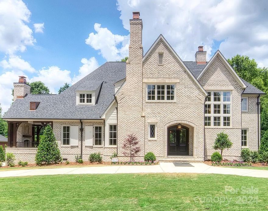 The perfect combination of traditional full brick exterior matched with modern living interior. From the double door entryway showcasing 5" white oak flooring to a view complete to the backyard and a beautiful curved staircase you will be excited to see more! Open plan showcases the high end appointed kitchen w subzero built in refrigerator, 48"wolfe stove and marble island with views to the cast stone fireplace surround. 
Full laundry rooms on both floors, Dining room with an adjacent wet bar with beverage center and a side veranda &  wood burning fireplace to cozy up by after dinner. Your study on main is complete w gas log fp. There is a covered large back screened lanai  to enjoy your level fenced back yard . Upstairs has 4 oversized bedrooms all with ensuite baths. A  gym and a large movie/bonus room completes the perfect upper floor. Conveniences of grocery and shopping abound! Circular drive for your invited guest adds style & convenience. A premiere Simonini Built Home !