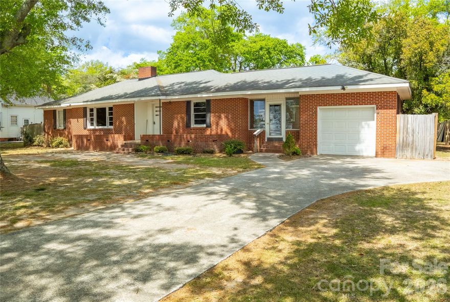 Welcome home to comfort, charm, and opportunity! This beautifully all-brick home is full of character and perfectly positioned on a desirable corner lot in a quiet neighborhood—just a short stroll from town. Even better… owner financing is available with down payment, making this an incredible opportunity you don’t want to miss!
Step inside and feel right at home with a warm, inviting layout featuring 3 spacious bedrooms, 1 bath, a cozy den, and a formal living room with a fireplace that can easily transform into a 4th bedroom, home office, or flex space to fit your lifestyle.
You’ll appreciate the added functionality of the half-basement/underground storage area, conveniently accessed from the laundry room, where the gas water heater and HVAC system are located. A charming enclosed sitting area connects the home to the garage—perfect for morning coffee or winding down in the evenings—plus a small back porch with a ramp for easy access.
Outside, enjoy a circular driveway for easy parking, a 1-car garage, and a fenced backyard ready for pets, play, or entertaining family and friends.
Solid brick construction, flexible living space, and a location that feels like home… this one truly has it all—with flexible financing options to make it yours!
Call today to schedule your private showing—this opportunity won’t last!