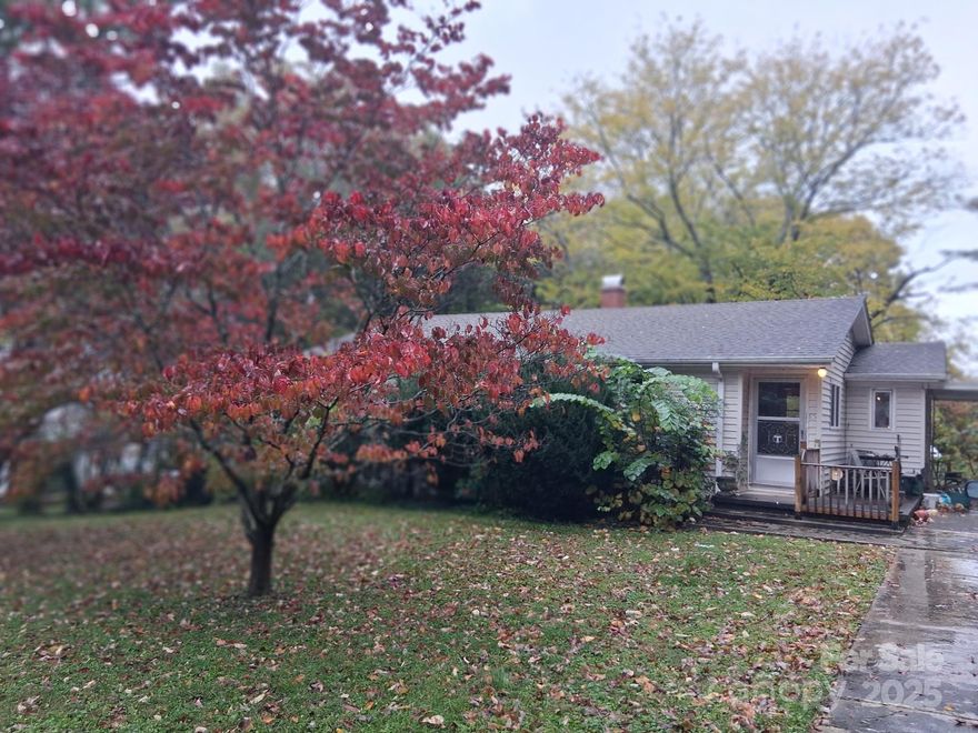 Welcome to this inviting 3-bedroom, 1-bath home offering 1,173 square feet of comfortable living space on a generous 0.4-acre lot. Ideally located just minutes from downtown Asheville, this property combines convenience, comfort, and potential. Step inside to a spacious living room filled with natural light, perfect for relaxing or entertaining. The home features thermal windows throughout, enhancing energy efficiency and comfort year-round. The large primary bedroom and an equally roomy secondary bedroom provide plenty of space, while the third bedroom offers flexibility as a home office or den — creating an open flow with access to the living room from two sides. Enjoy the outdoors on the front deck built in 2023, ideal for morning coffee or evening gatherings. The large unfinished basement provides abundant storage and incredible potential for future expansion or customization.