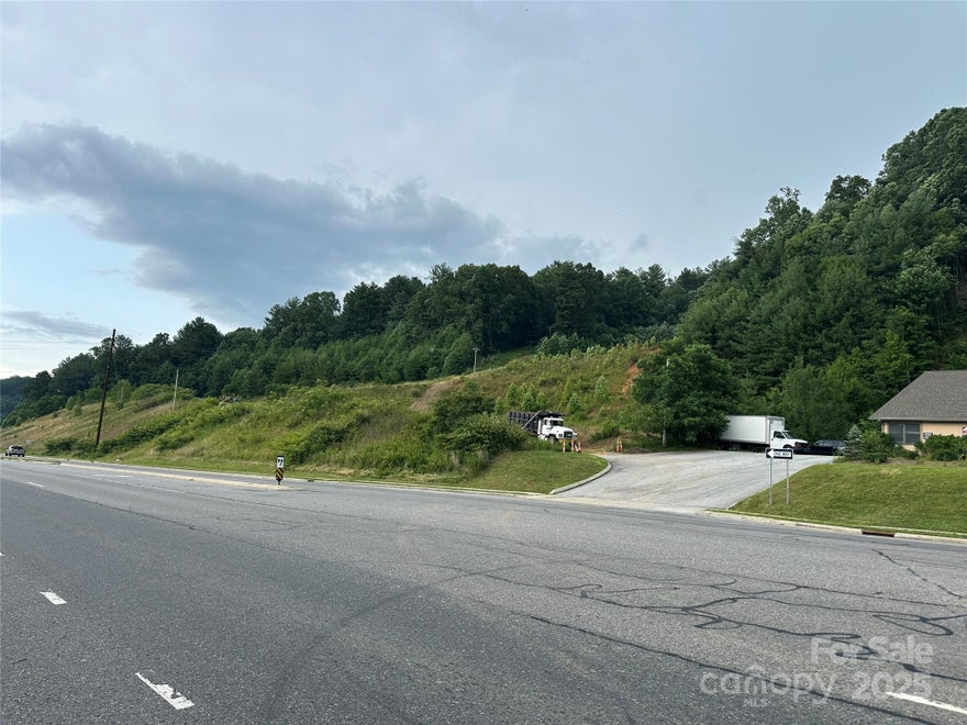 This incredible site for commercial development gives the perfect place for your investment. With 180 degree long range views it makes a perfect hotel location. Plenty of land for parking. If you prefer retail space or office/warehouse this site gives some great retail visibility that will support any business. The seller will consider sub diving the site and has extensive development experience if buyer needs help bringing their plan to life. Water and sewer are adjacent to the site. Power is already onsite also. The upper acreage is a great buffer and could be used for other purposes. There is a second cleared build site on the upper level that seems better suited for an apartment building or office space. Similar land nearby has closed for much higher price per acre.