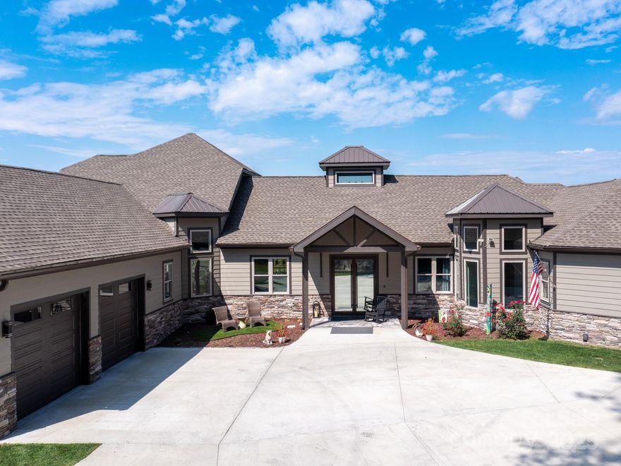 Exquisite Private Estate – A Masterpiece of Design & Craftsmanship
Nestled in the midst of WNC best orchards and vineyards, this builder’s own private estate offers a rare combination of luxury, privacy, and natural beauty. Set on a sprawling 2.7-acre parcel, this home is surrounded by the serene countryside, offering sweeping views of beautiful sunsets, mountain ranges and rolling fields from every room. Despite its tranquil, secluded location, the estate is just minutes away from shopping, dining, and travel, offering the perfect balance of peaceful living with easy access to all modern conveniences.

IMPRESSIVE ENTRANCE & GRAND LIVING SPACES:
As you approach the home, you’re greeted by custom double entry doors that open into a soaring 25-foot foyer adorned with pristine marble tile flooring. Every corner of the home is designed to impress, with 8' doors through out, high ceilings, sliding doors and wall-to-wall windows that frame panoramic views of the surrounding landscape.

PERFECT FOR ENTERTAINING:
The heart of the home is the main level entertainment bar, featuring a stunning wood plank barrel ceiling. This fully equipped space is perfect for hosting, complete with a keg dispenser, glass washer, wine holder, beverage cooler, and a wine fridge. Windows open to a breathtaking outdoor bar and over 600 square feet of outdoor space, making indoor/outdoor entertaining effortless.

The formal dining room with a cathedral ceiling is a perfect setting for elegant gatherings, while the spacious family room with a gas fireplace offers the ideal spot for intimate relaxation. The adjoining breakfast area with a breakfast bar provides a cozy spot to enjoy your morning routine.

GOURMET KITCHEN:
The chef’s kitchen is a true work of art. Boasting a 10-foot seated island, high-end appliances, including a 6-foot Thermador fridge/freezer, convection wall oven, induction cooktop with downdraft, and pot filler, this space is perfect for both culinary professionals and home cooks. A built-in pizza oven adds a fun touch for pizza enthusiasts. The Butler’s pantry features a prep sink, pass-through to the main kitchen, and large windows to keep the space light and airy. Custom cabinetry and granite countertops complete the gourmet experience.
Elevator will take you to the sky bar lounge with wall to wall windows and captivating views.  

LUXURIOUS PRIMARY SUITE:
The primary ensuite wing is a true retreat, offering ultimate privacy and luxury. Enjoy breathtaking views through 12-foot sliders that lead to a private balcony. The spa-like bath features a freestanding soaker tub, his-and-hers vanities, and a 20-foot ceiling shower with a rain head and partner body sprays. Step out onto your private balcony with an outdoor shower for the ultimate relaxation experience. The custom walk-in closet is a masterpiece with an island and ample space for your wardrobe.

ADDITIONAL BEDROOMS AND APARTMENT:
The home also features an elegant guest suite with a private bath and an office for work or study. The fully finished lower level is designed as a private apartment with a separate garage. This level includes a living area, kitchenette, dining space, bedroom, large bath, and a bonus room. The space opens to a covered patio area, offering magnificent views of the surrounding mountains and fields.

EXTRAORDINARY AMENITIES & UNMATCHED VIEWS:
Downstairs, you'll find a wine cellar and a gym—both designed with the finest materials and finishes. All areas of the home open to outdoor spaces designed for both relaxation and entertainment, including massive views of the surrounding landscape. The estate is perfectly positioned for those who love the charm of rural living, while being close enough to major conveniences, making it the best of both worlds.

With a 5-car garage, courtyard parking, and ample space for guests, this estate is designed for those who appreciate the finest in luxury living.