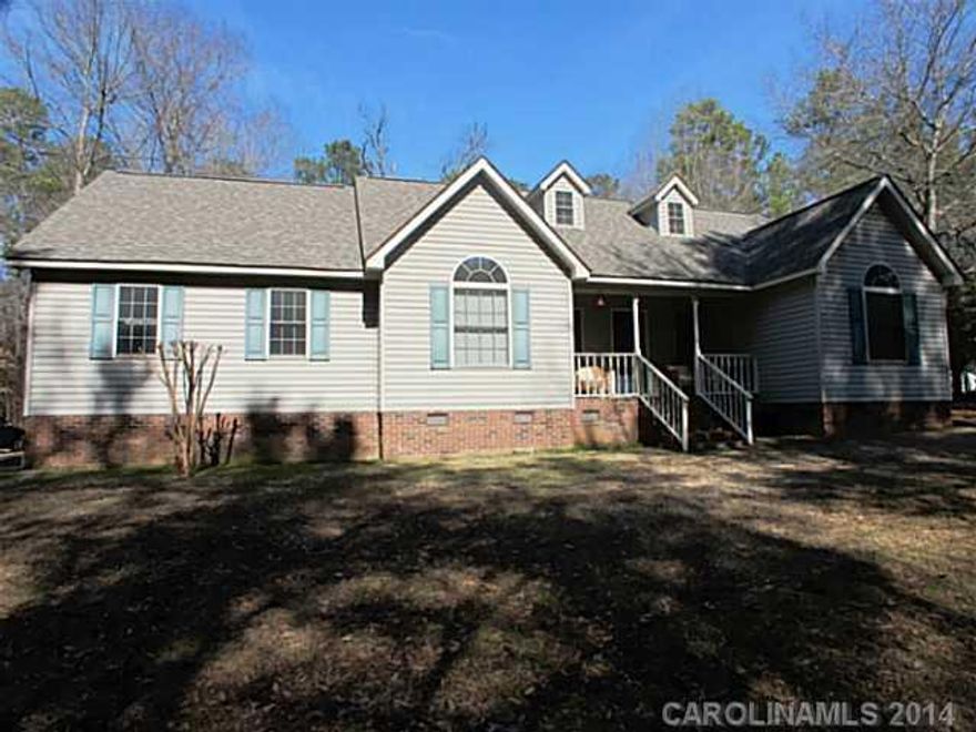 Impeccable 3 bedroom 2.5 bath with new roof 2012.Home features hardwood floors, living room w/ fireplace, split floor plan,large master suite with walk-in closets,separate tub and shower in master bath, split floor plan, all bedrooms on main level, sewing room upstairs in finished room over garage, 2 car attached garage,hidden away between trees in a forest setting. Great location near shops.