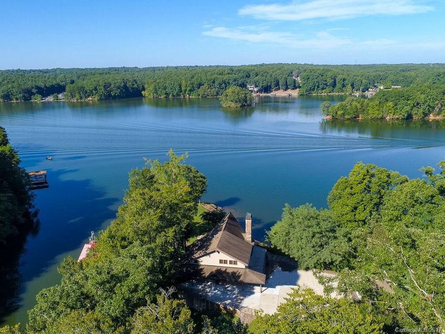 Views, Views, Views.  Gorgeous home located on Lake Norman in gated community on 1.41 acres with total privacy. Beautiful Open floor plan featuring Gourmet kitchen w/granite counter tops, SS appliances and lots of cabinets.  Large family room with fireplace and beautiful views.  Huge Master Suite with  fireplace, large master bath and loft area overlooking lake.  Finished Walkout basement w/large family room and fireplace. Large deck with unbelievable views of the lake. Over 300' of waterfront.