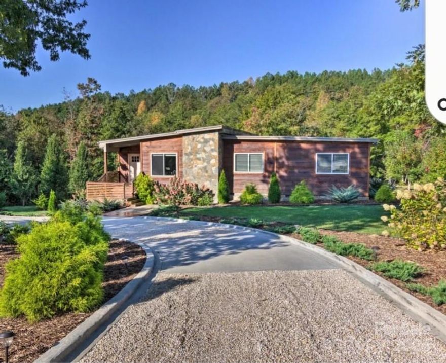 Beautifull Modern Cabin, nicely set on a cul-de-sac, in a private small, gated community with streetlights and underground utilities. Excellent cabin with open floor plan of living area, dining area with vaulted ceilings, modern kitchen cabinets with a granite counter tops. Bamboo floors. The Large master bedroom offers a full en suite & roomy walk-in closet, glass doors open to a large deck. Two nice bedrooms with queen side beds capacity, an ample second bathroom.  Large laundry room with sink and a back outside door. Very large Fire Pit to accommodate large group of people. Also, a big studio o storage place next to the house. Short Terms rentals allowed.  Close to Lake Lure and Chimmie Rock, Tryon Equestrian Center and many Vineyards and wineries. (within15 minutes) Charlotte, Asheville and Greenville within an hour drive. Great location!!  Come and see it today.