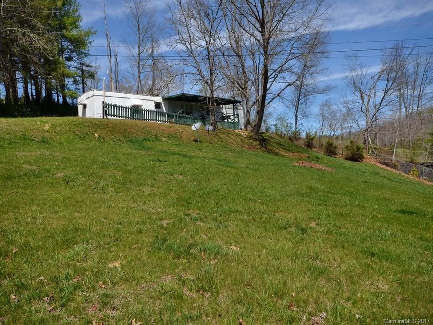 Adorable single wide with great views and really nice yard!  Clean as a pin!  Nice master bedroom and updated kitchen with stainless steel. Come relax on the front porch and take in the view!  Fifteen minutes from Main St. Waynesville.  Cash only! Pre inspected.