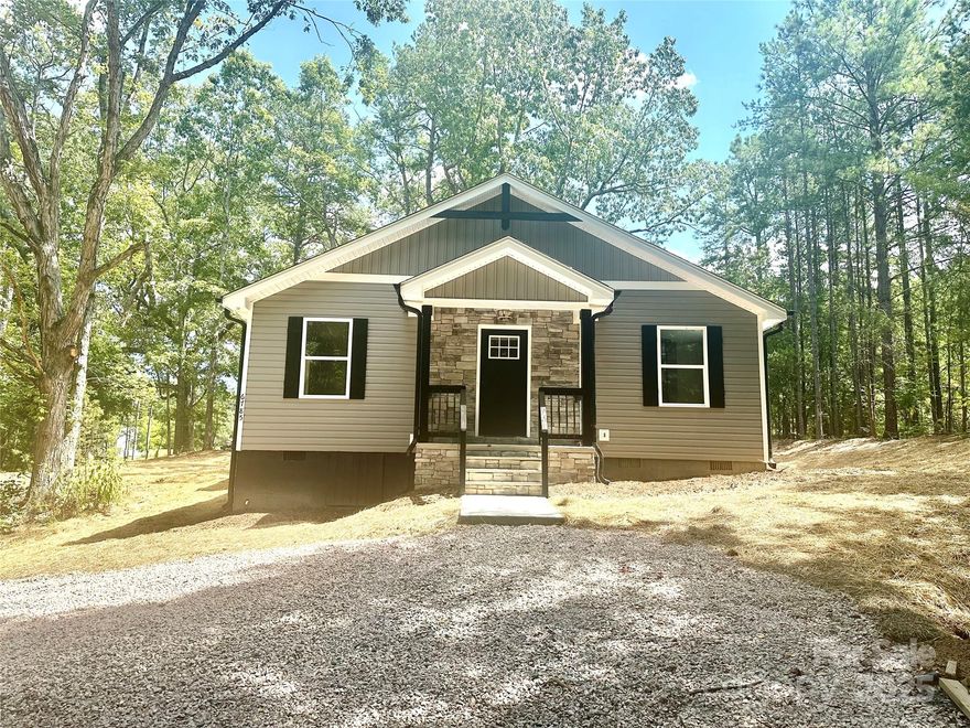 Rare find at this price point!  Newly constructed 3BR/2BA one-level home on a 3.04 acre lot sitting back off the road for your privacy.  About a mile-and-a-half from all the fun things happening in downtown Kannapolis, this is a gem!  Beautiful LVP throughout with veined ceramic tile in both full baths.  What a joy for the chef to prepare meals in the sleek kitchen with stainless GE appliances, white shaker cabinets, granite tops, natural stone backsplash, & substantial pantry.  There is a pass through at the Kitchen sink looking into the Dining Area making clearing the table a breeze.  The Primary ensuite will easily accommodate a King bed, and your morning routine is painless with separate vanities. All bedroom closets feature stylish barn doors.  Enjoy your morning coffee out on the back patio and take in the sights of your land.  BACK ON THE MARKET AT NO FAULT OF SELLER; BUYER'S CIRCUMSTANCES CHANGED.