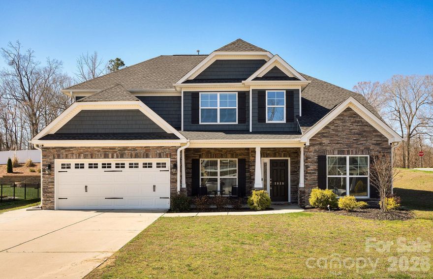 Beautiful home on a corner lot in Swan's Landing offering space, style, and flexibility! This 5-bedroom, 3.5-bath home features a main-level primary suite with a private bath including a separate shower and relaxing garden tub. The kitchen is designed for gathering with granite countertops, cherry cabinets, tile backsplash, center island, and a dedicated coffee bar. Elegant, coffered ceilings add character, while the sunroom provides a bright and inviting space to unwind or entertain. Upstairs you’ll find four additional bedrooms and a spacious loft area, perfect for a second living space, office, or playroom. One upstairs bedroom even features its own full bath and walk-in closet, making it ideal for guests or extended living arrangements. With thoughtful details and generous living space throughout, this home offers comfort, functionality, and room to grow.