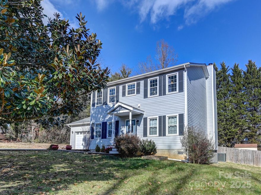 Discover this wonderful 3-bedroom home in the desirable Oakley neighborhood of Sweetbriar Grove, offering a perfect blend of comfort and convenience. This picturesque house is just a short drive from downtown Asheville and South Asheville, providing easy access to all the area has to offer. Set on a level corner lot on a quiet cul-de-sac street just outside city limits, this home offers tranquility and accessibility. The main floor features a spacious layout with a 1/2 bath, bonus room, office, large kitchen, dining area, and a cozy family room. Upstairs, you'll find 3 bedrooms, including the owner's suite, 2 full baths, and a convenient laundry room. The property also has an attached 2-car garage, a fenced backyard perfect for pets and gatherings, and a large rear deck with a retractable awning to enjoy summer evenings outdoors. Plus, the renowned Mountains-to-Sea Trail is close by, allowing you to explore nature from your home!  Don't miss this incredible home!