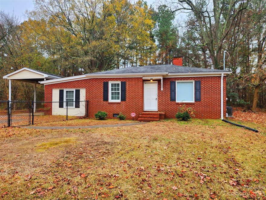 Quaint and charming 2 bed and 2 bath home situated in Bessemer City is sure to fit your family's needs! Very private on quiet road. New refrigerator, range, exhaust hood, vinyl flooring, security system, carpet, water heater and paint. New plumbing and fixtures. A large living room with fireplace. The home also has two bonus rooms. Located on a large, private, fenced parcel. Located close to Interstate 85 and also only a few miles from the Two Kings Casino. This home is sure to impress! Back on Market no fault of seller,