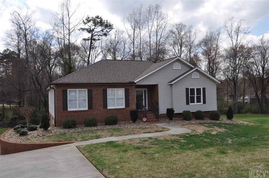 A beautiful 4 Bedroom 3 Bath with vaulted ceilings on 0.39 acres in Hickory ready for you to call “home”. Warm flowing hardwoods greet you as you enter.  The Living Room is accented with a tile surround/hearth enclosed gas fireplace. The Large Kitchen displays granite countertops, tile flooring, cabinet storage, and room for entertaining. The Dining Room is separated by open doorways and highlighted with natural light. Master Bedroom has walk-in closets, carpet flooring, and a Master Bath. Master Bath is decorated with a garden tub, shower, cabinet storage, and tile flooring. Screen porch with open views of the property just off the Kitchen. Downstairs Den includes Full Bath, spacious Bedroom, and French doors that access a shaded patio. Large double Garage with 2 spacious storage rooms. Home Warranty included.