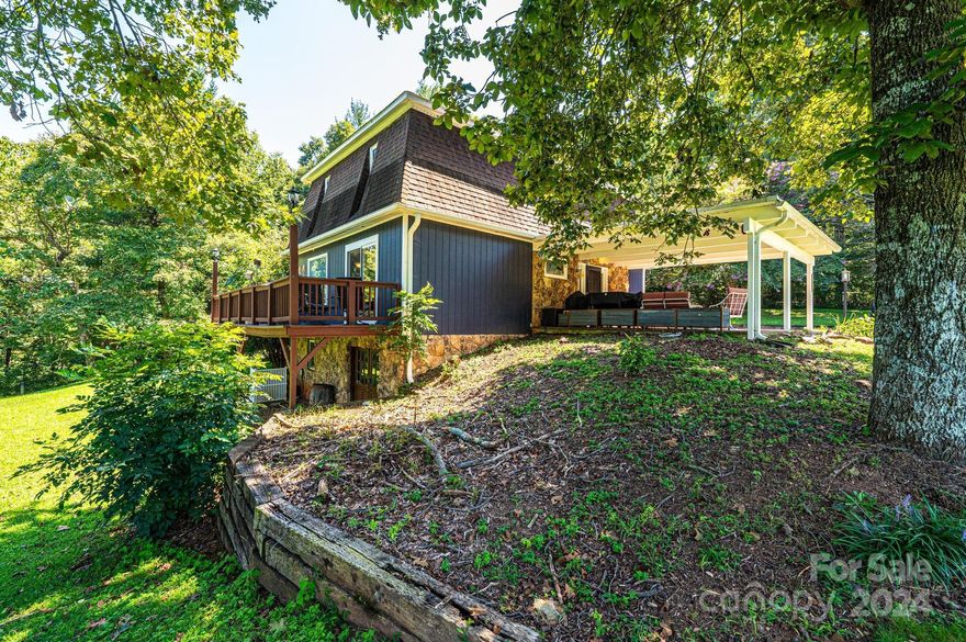 Welcome to 7721 Woodland Hills Rd., a charming 3-bedroom, 2.5-bathroom home nestled in a peaceful neighborhood. This property offers the perfect blend of comfort, convenience, and character. Inside, the cozy living area is enhanced by a beautiful stone fireplace. The main kitchen is well-equipped with appliances, including an oven, fridge, dishwasher, and microwave, while a second kitchen located in the unfinished portion of the basement features a fridge, oven, and sink. The basement also includes a partially finished bonus room, a versatile space that can serve as a home office, playroom, or extra storage. The laundry room, complete with a washer and dryer, adds convenience to your daily routine. The detached garage is more than just a place to park; it hosts a workshop that will be any woodworker's dream. Outside, the property boasts a fruiting peach tree, adding a sweet touch to your outdoor experience. Situated just a short stroll from the picturesque Henry River.