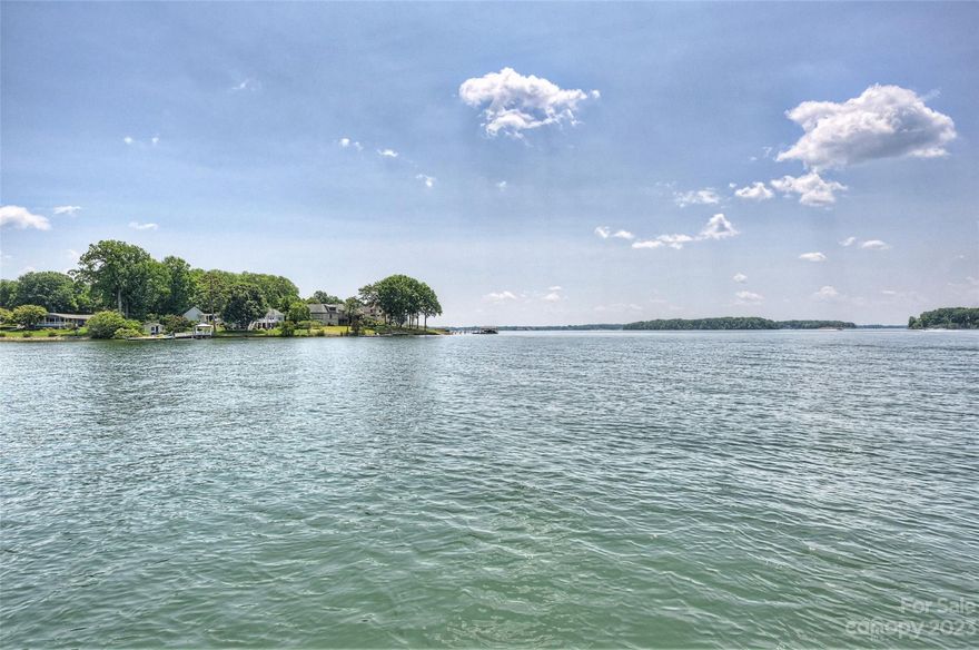Great opportunity to build waterfront dream home or renovate the existing cottage.  Situated in Iredell County, Mooresville. No HOA!  Featuring amazing views of Lake Norman.  Very very close to the main channel.  Shoreline is just shy of 200' with shoreline improvement already in place.  Grandfathered boathouse plus two boat ramps and a private dock.  Beautiful mature trees that offer a private setting.  Sit back, relax and appreciate the spectacular views.