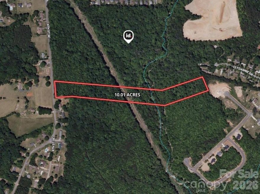 Here' your chance to own 10+ acres in Catawba County that adjoins 400+ acres of land owned by the state of NC. This parcel has endless opportunities. It features rolling topography, a creek, paved road frontage and a couple of different building sites. The lot is a portion of a larger parcel and will need to be surveyed and recorded prior to closing.