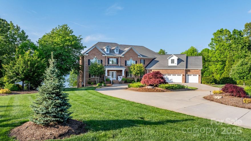 Welcome to Eagle’s View, where breathtaking views, and resort-style amenities create the ultimate Lake Hickory oasis. This 4 bedroom 6 bathroom home features a gourmet kitchen with custom cabinetry, granite counters, high-end appliances, and two wood burning fireplaces. The main level includes a spacious bedroom, keeping room, and a versatile drop zone leading to an office, mudroom, and additional storage. Upstairs, the lavish primary suite boasts lake views, a sitting area, and a spa-like bath. The walk-out basement offers a game room, flex room, and tons of conditioned storage. Outside, enjoy a heated pool and spa, fenced dog area, and a covered boat dock with lift. Expertly landscaped grounds feature a multi zone irrigation system fed by the lake. Just minutes from golf courses, amenities and shopping, this gated property is the ultimate retreat to provide memories with family and friends for years to come.  Schedule a private showing today.