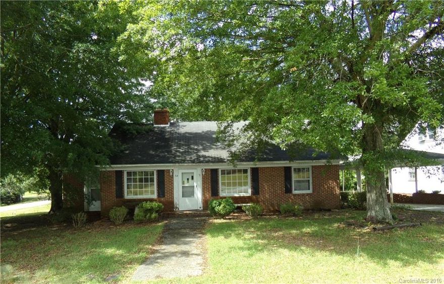 Make this spacious house a home with your own update/renovation ideas.  It is located on a spacious corner lot, in a well established neighborhood.  There is a side enclosed porch, storage/tool shed, living room with fireplace, kitchen, dining, three bedrooms and two bathrooms.