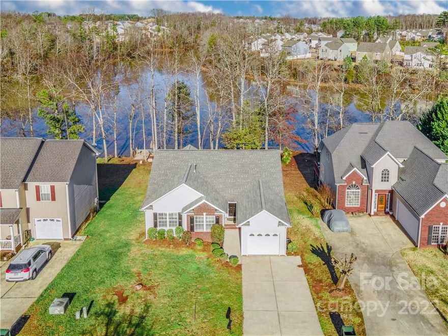 Stunning 3 bedroom, 2 bathroom ranch with a single car garage, split bedroom plan, spacious great room with sliding glass doors leading out to a massive back deck! The waterfront location on the Upper York Reservoir is perfect for fishing, kayaking, or enjoying the views from the spacious back deck. Large bay windows in the dining area and primary bedroom also allow for scenic views of the water and vaulted ceilings help to make these spaces open and light. This house has fresh paint, new flooring and carpet, and has been meticulously maintained by the original homeowner. Irrigation sold as-is (no known issues). Fireplace in great room conveys. A stellar opportunity for anyone wanting a private setting without sacrificing proximity to the city!