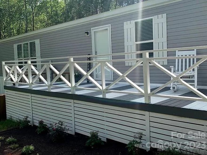 Enjoy this completely secluded 4 acres with lots of open space. Spacious, open floor plan 2019 MH, with screened in porch, deck and pool with newer filter system.  Multiple storage buildings and plenty of space for parking. Owner has moved out. All furnishings have been removed. MH has been retired to the property.