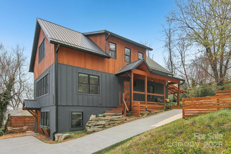 Nestled in the heart of East/West Asheville lies a remarkable Mountain Modern residence with unmatched energy efficiency and versatility. Like new, impeccably maintained, and freshly painted inside, this low maintenance home has served as a primary residence and an incredible rental property (ask agent for details). Countless Green, energy saving features make this an extremely comfortable dwelling year round and provide lower utility costs! Meanwhile, the proximity to Haywood Rd bakeries, breweries and restaurants (1 block) means you'll rarely need a vehicle, and downtown is just 2 miles away! Savor the privacy of the expansive covered patio with a hot tub, native boulders, and thoughtful landscaping-your own urban sanctuary! Best of all, this home features a basement apartment that can be used as a short, medium, or long term rental for a reliable income stream- or as guest quarters. We're taking this property off the market Mon, 5/17 so schedule your showing while you still can!