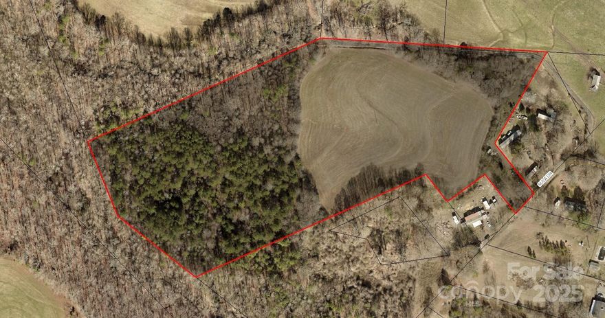 Over 14 acres of beautiful land that includes about 5 acres already cleared. Located on a private road that makes it feel tucked even further away than it really is. Ideal for building a new home or placing a manufactured or modular home on. Per Cleveland County planning dept, this property can be subdivided one time as long as one of the tracts remain at least 10 acres. New survey will be provided. County water is available with tap fee and meter. Septic is needed. Abundant with wildlife.  The wooded acres include 4 wheeling trails that run throughout it and could be further cleared for a home site or whatever your heart desires. 
Disclosure: Listing Agent is owner. This is part of a 20 acre tract but 5-6 acres will be split off pending survey, prior to closing. Images reflect projected property lines, not existing lines.