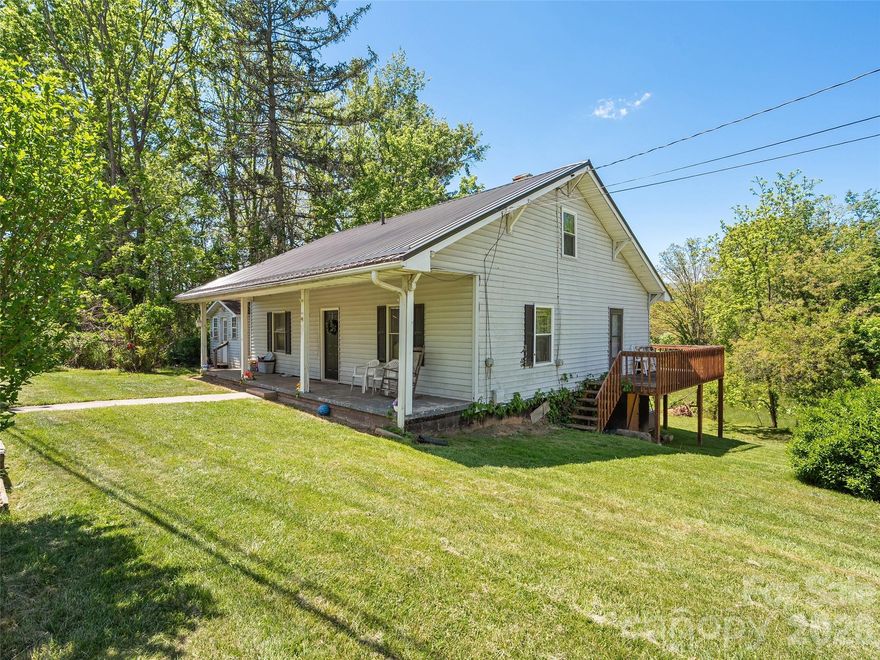 Discover this affordable inviting Farmhouse style home boasting over 1,100 square feet of finished living area. Built with classic lines and timeless appeal, this 2-bedroom, 2-bath single level living residence offers a practical yet spacious layout perfect for comfortable living. The primary suite features a walk-in shower, generous closet. An open kitchen flows effortlessly into the separate living room, creating an ideal space for family gatherings and everyday enjoyment. Step outside the durable updated metal roof providing long-lasting protection and low maintenance. A wraparound deck invites you to enjoy fresh air, morning coffee, or evening relaxation. The property includes city water service paired with a shared septic system, along with a recently updated HVAC system for reliable comfort and efficiency year-round. This home combines classic Four-Square architecture with thoughtful modern upgrades, delivering character, it’s an outstanding affordable opportunity for families, first-time buyers!
