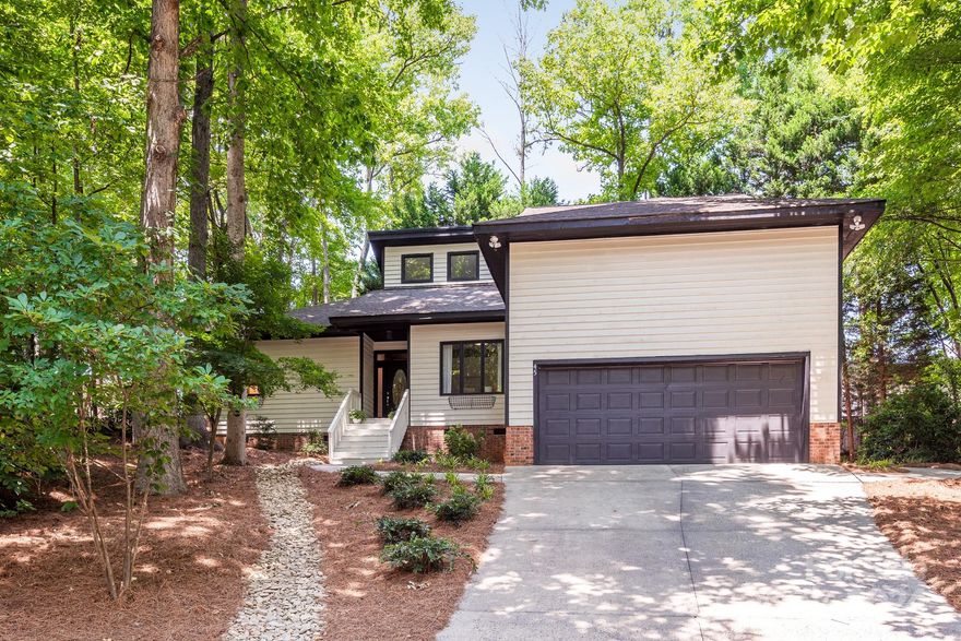 This is it! Welcome home to this gorgeous turnkey residence in desirable River Hills, a well established gated and guarded neighborhood with excellent amenities and access to Lake Wylie. This home features a freshly landscaped low-maintenance yard, updated kitchen and baths, fresh paint, beautiful real oak hardwoods throughout the main level, all new laundry room and 2 freshly painted rear decks. Stunning owner's suite on main level with new custom closet and dream bath. Sunroom with lots of natural light and cozy gas fireplace. Electric car charger in garage and Cat-6 wiring throughout. This quiet cul-de-sac location is close to the front and back neighborhood gates for fast and easy in and out!