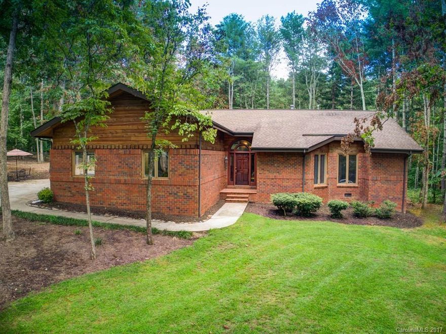 Coveted Tree Top Dr. in Arden! One level brick contemporary in excellent location! Beautiful wooded lot backs up to Christ School property( 458 acres). Vaulted and 9ft ceilings, lots of windows to enhance the natural light. Screened porch, formal dining room with hardwoods, 2 car garage w/ built in cabinets and large storage closet. Wood burning stove with new SS liner.Walking distance to Glen Arden Elementary. Come see it while its still available.