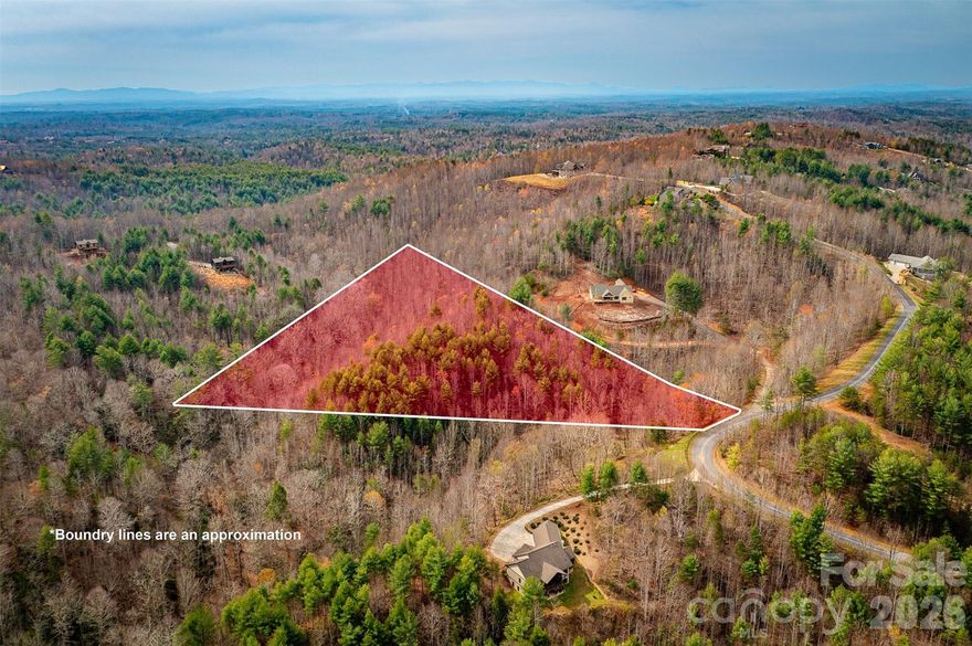 Nestled within The Coves Mountain River Club, this exceptional 7.06-acre wooded homesite offers the perfect blend of privacy, mountain views, and outstanding buildability. Gently rolling topography provides multiple ideal building sites, allowing for an easy driveway approach and flexibility in home design. Enjoy seasonal to potential year-round long-range mountain views, surrounded by mature hardwoods and the natural beauty of the Blue Ridge foothills. Whether you’re envisioning a full-time residence or a mountain retreat, this property offers a rare opportunity to build with ease in a serene, private setting. Located within a gated 3,200+ acre community known for its scenic river frontage, extensive trail system, and luxury amenities—including a mountaintop clubhouse, fitness center, pool, equestrian facilities, and over 5 miles of Johns River access. This homesite combines natural beauty with an active mountain lifestyle. A premier homesite with space, views, and usability—ready for your dream home in the North Carolina mountains.