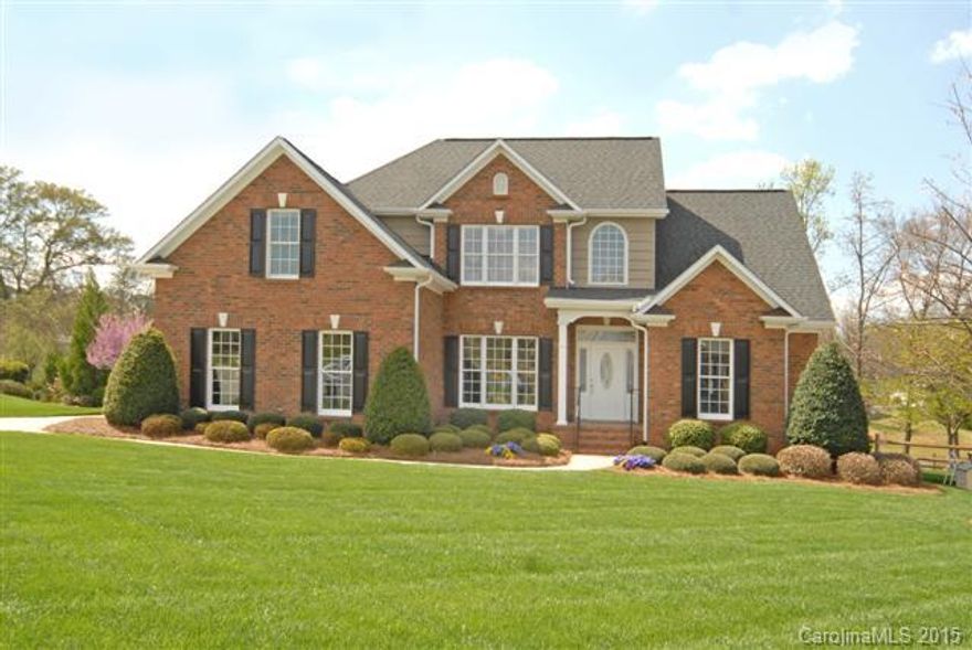 Wonderful brick home w/ Master on main has trey ceiling w/ ambient lighting, WIC. Formal DR w/ arched entrance. Hardwoods, heavy mouldings, Eat-In Kitchen has custom cabinets, granite, 2 pantries, stainless appliances. Vaulted Great Room with Gas Logs & Media Niche. Upstairs has 2 BR's, 4th Bedroom/Bonus Room plus great storage areas. Private fenced backyard overlooks pond. Full irrigation. Home Warranty Included.