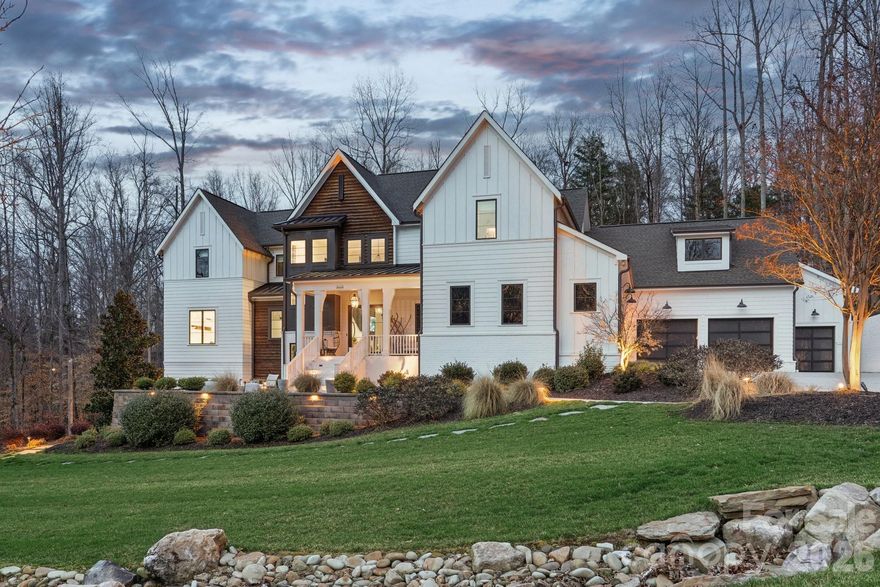 Exceptional luxury living in the highly sought-after River Run community of Davidson. Situated on a private 1.5+ acre estate lot, this stunning custom home blends elegant design, modern comfort, and resort-style outdoor living. Thoughtfully designed with expansive living spaces, high-end finishes, and seamless indoor-outdoor flow, the home offers both sophistication and functionality for everyday living and entertaining.

The chef’s kitchen features professional-grade appliances, a large center island, and custom cabinetry, opening to spacious living and dining areas filled with natural light. The main level includes a luxurious primary suite and guest accommodations designed for comfort and privacy, while additional living areas and flexible spaces throughout the home provide room for work, fitness, and entertainment.

Step outside to your private backyard retreat designed for year-round enjoyment. The grounds feature a custom pool with slide, pickleball court, basketball court, private putting green, and multiple gathering areas including a fire pit with seating, outdoor kitchen by the pool, and a wood-fired pizza oven—creating the ultimate setting for entertaining and recreation.

Additional highlights include a 4-car garage plus dedicated golf cart garage, beautifully landscaped grounds, and expansive outdoor living spaces. Located within the desirable River Run community offering golf, tennis, swimming, and scenic walking trails, all just minutes from charming downtown Davidson, Lake Norman, dining, and shopping.