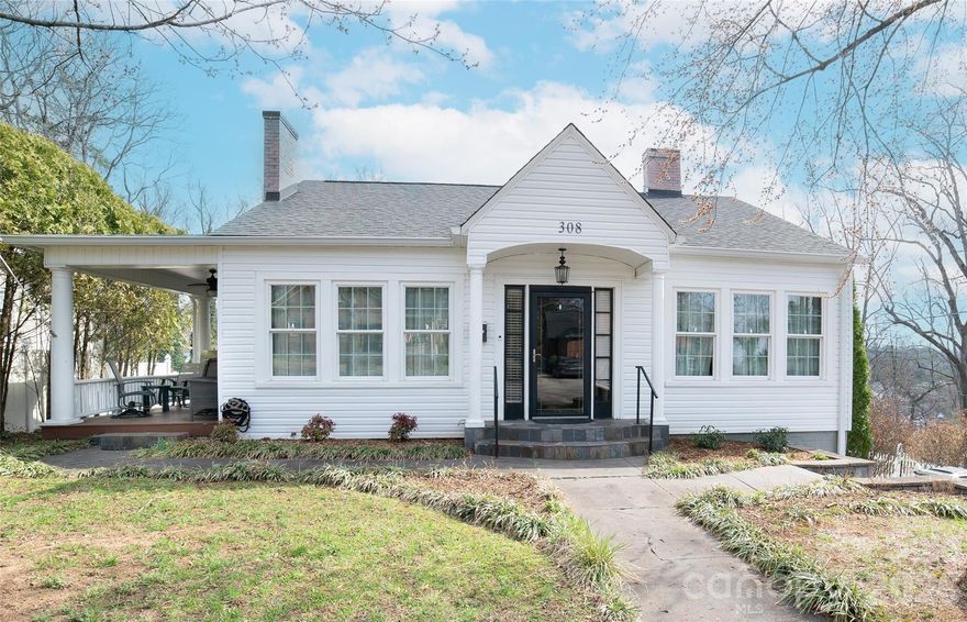 Step inside and fall in love with this beautifully updated home, where timeless charm meets thoughtful modern upgrades. With 9-foot ceilings and hardwood floors throughout, the open layout creates an inviting space perfect for both everyday living and entertaining. The designer kitchen is truly the heart of the home, featuring abundant cabinetry including a full wall of pantry storage, a large island with seating, breakfast bar, generous granite countertops, and high-end finishes. Cooking enthusiasts will appreciate the 5-burner gas cooktop, double wall ovens, pot filler, farmhouse sink, soft-close drawers, and convenient pull-out shelving. The dining room showcases a stunning bay window with an elegant marble window seat, creating the perfect place to relax with morning coffee or evening conversation. The spacious great room features a cozy gas log fireplace and opens to a charming side porch. Just off the great room, a versatile office could easily serve as a library, music room, or creative space.
The beautifully designed laundry room offers additional cabinetry and pantry storage, while the recently remodeled bathroom adds modern style and comfort. Outdoor living is just as inviting, with a picturesque side porch perfect for relaxing, plus a back deck ideal for grilling and entertaining, all overlooking a private yard—perfect for gathering with family and friends. A basement workshop and storage area provides plenty of space for hobbies and projects.