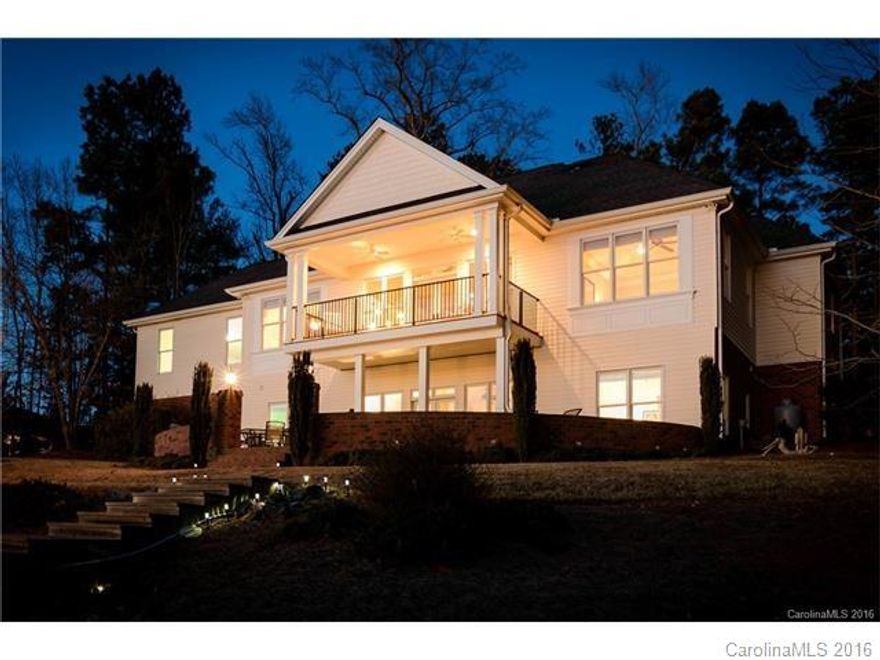 Miles of beautiful views from this custom built home on Lake Tillery. Point lot on a cul-de-sac located in Swift Island Plantation which is a gated community. Open floorplan with massive windows to the lake on both levels of the home. The master is finished beautifully on the main level with great lake views as well. Entertain inside or out with decks, a covered porch and a basement great room designed for lake living. Five bedrooms / four full baths. Gently sloped lot to the lake and boathouse.