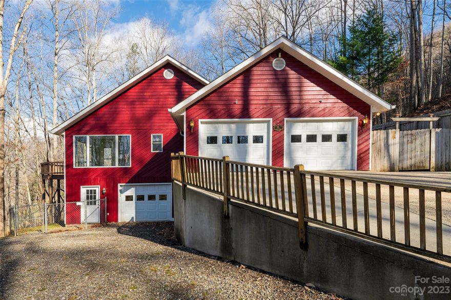 Stunning mountain home nestled on a no-thru street offering a peaceful & private setting with 5.7 acres & gracious winter mountain views. This custom home has a spacious open floor plan w/3 luxurious bedroom suites, large bonus room w/ bath, vaulted ceilings, automatic skylights, expansive decking & a multitude of stunning renovations. Designed for entertaining & flooded with natural light, the granite kitchen has a large center island, gas stove & delightful eating area surrounded by windows & adjacent to the large deck. The primary suite is conveniently located on the main level w/oversized walk-thru closets & renovated bathroom w/soaking tub & luxury tile shower. 2000sf on main level & an additional 1000sf on LL with 2 bedroom suites, spacious living room w/brick fireplace & full kitchenette – perfect for in-laws, guests or flex space. See complete features list: Whole house generator, 3 garages, radiant floor heating, A/C, thermo-pane doors/windows, new roof, workshop & more.