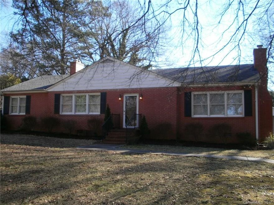 Nicely maintained brick home loaded with charming features--hardwood floors, fireplace in living room and den, and updated kitchen open to living area.  Refrigerator, Washer and Dryer to remain.  Detached two-car carport with storage space. Seller providing one year Home Warranty. One of carport spaces currently used as a screened porch.  163 square foot utility/storage space attached to carport.
