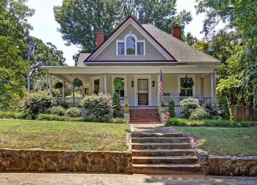 Victorian Bungalow beautifully renovated master suite bedroom, bath with whirlpool,tiled shower,walk in closet.Hardwood floors thru-out home,3 fireplaces with gas coal, updated kitchen with stainless gas range,&appliances, wet bar in kitchen,3 full baths and 1 half bath, Wine cellar in basement, wrap around porch, fenced in back yard with deck and brick patio,two story two car garage with workshop, and upstairs for rec room, etc.  Great house!! Minutes from downtown, park ,tennis courts and I77.