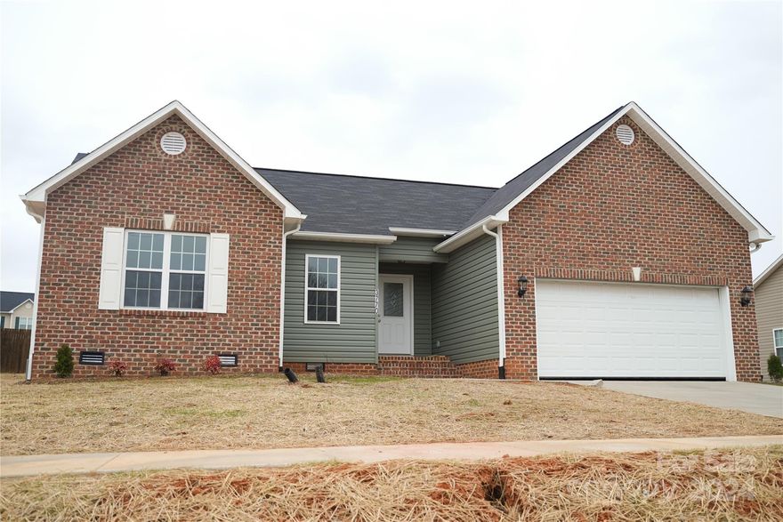 Brand New Construction!  Great Home for first time home buyers in the city limits of Conover!  This house features an open floor plan with 3 bedrooms, 2 full baths, and an attached 2 car garage.  There are ceiling fans in the Great Room and Master Bedroom.  The Great Room has vaulted ceilings, a gas log fireplace for getting cozy on those cold evenings, and access to a treated wood deck for entertaining on the warmer days.  Kitchen appliances include a Freestanding Range, Dishwasher, Microwave and Disposal, Granite Tops on all Base Cabinets.  The Master Bedroom has an attached master bathroom and a walk-in closet.  Conveniently located, the laundry room is right outside of the master bedroom and fully equipped with washer and dryer hookups.  The flooring is there to last with luxury vinyl plank covering throughout.  No Carpet!  Interior trim has crown molding and chair rail with backer.  City water and sewer.