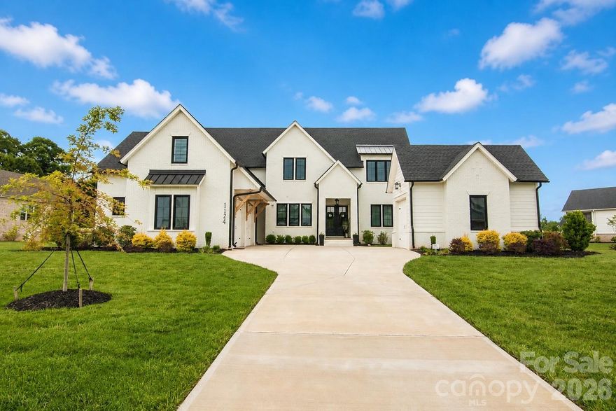 Welcome to your dream home in Broadmoor at Marvin, offering 3/4 of an acre of outdoor space, featuring a motorized screen porch leading out to your pool, hot tub and fire pit. This spacious and meticulously designed single-family home was completed in 2024 with 5 bedrooms and 4 full bathrooms; this home perfectly blends comfort and functionality. Step inside and be greeted by a bright and inviting foyer that sets the tone for the rest of the home. Work from home? You will love the office on main level, that can also be used as a guest suite with attached full bathroom. The thoughtfully designed kitchen is equipped with a gas cooktop, large island, custom cabinetry to the ceiling to maximize storage, and a huge walk-in pantry, providing ample storage and workspace for all your culinary needs. Eat-in breakfast nook surrounded by windows brings in the warmth of natural light. The home’s layout is ideal for both relaxation and entertaining, complete with a gas fireplace that enhances the cozy living space. The primary suite on main level features vaulted ceiling, large windows overlooking pool and backyard, expansive custom closet, spa-like bathroom with oversized glass-enclosed shower, freestanding tub, and custom dual vanity. Attached 2-car garage with epoxy floor, built-in storage, plus a detached third garage also with epoxy floor that makes a great gym, workshop, or additional car storage. In addition, this home features integrated whole house sound system, exterior landscape lighting, irrigation, and hard-wired security system providing added peace of mind.