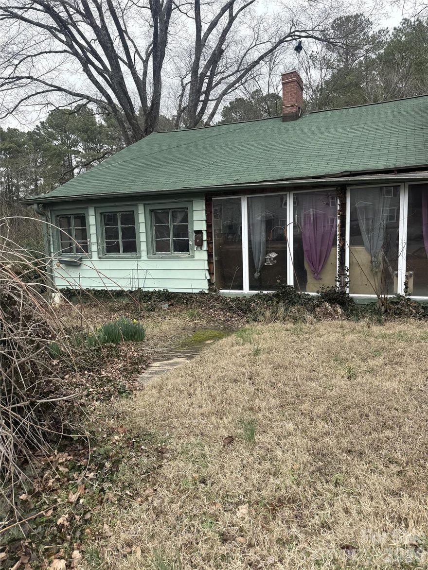 Investment Property. This fixer-upper is located in an established neighborhood in Spencer. 2Br, 1.5 baths home is located on .47 AC, but includes an additional 1.83 AC parcel (037 040) Additional parcel is partially located in a flood zone. Home is conveniently located near schools, I-85, shopping and restaurants. Roof approximately 5 years old, Hot water heater replaced in 2025, Heat/Air window unit 2025. Home is in need of quite a bit of work and is being sold "AS IS". Sellers to make NO repairs. Lots of personal property inside & outside of home. Seller will likely NOT be able to remove everything.