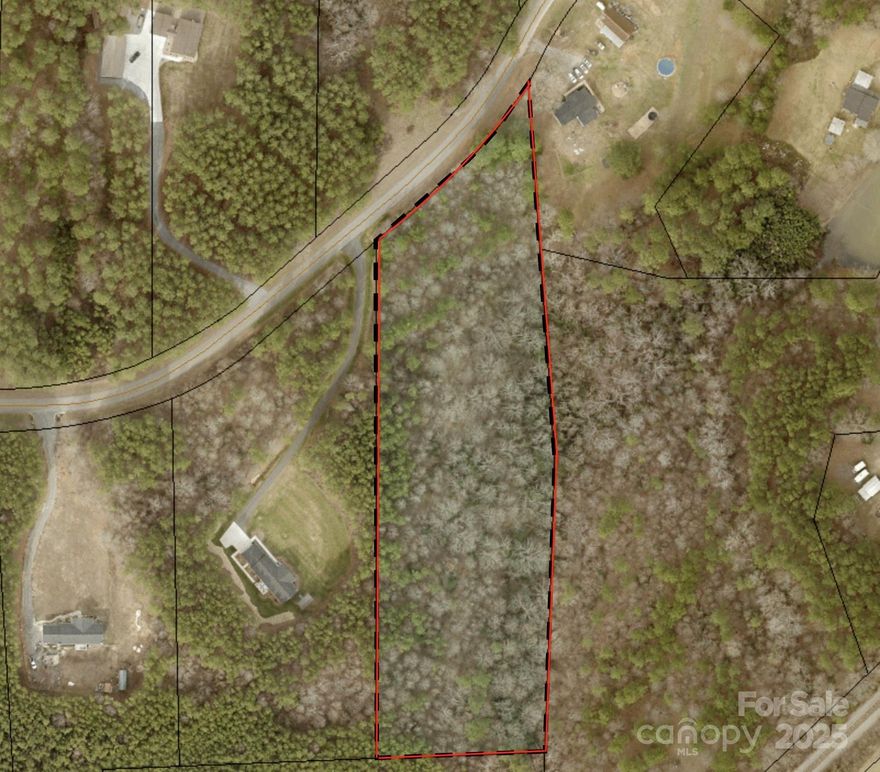 Discover an exceptional opportunity with this picturesque 4.98-acre parcel of vacant land in the serene countryside of Mooresboro. Perfectly suited for your dream home, weekend retreat, or agricultural endeavor, this property blends natural beauty with peaceful, rural living.

Key Features:

• Nearly 5 Acres of Buildable Land:
Spacious and versatile, this tract offers ample room to design and position a residence, outbuildings, gardens, or recreational spaces to suit your vision.

• Tranquil Streamfront Setting:
A gently flowing natural stream borders the property, providing soothing water sounds, seasonal wildlife viewing, and an enhanced sense of privacy and connection to nature. The stream is a centerpiece feature that elevates the property’s scenic appeal.

• Rural Charm with Convenient Access:
Enjoy the quiet charm of the North Carolina countryside while remaining within easy reach of local amenities in Mooresboro, Shelby, and surrounding communities. Ideal for buyers seeking a peaceful lifestyle without sacrificing accessibility.

• Natural Landscapes & Potential Uses:
Lush woods, open areas, and varied topography create opportunities for diverse uses—including homestead living, pastureland for small livestock, recreational use, or simply preserving your own natural haven.

• A Canvas for Your Vision:
Whether you’re planning a custom home site tucked among trees or designing outdoor spaces that complement the stream and terrain, this property provides a rare opportunity to build exactly what you’ve imagined.