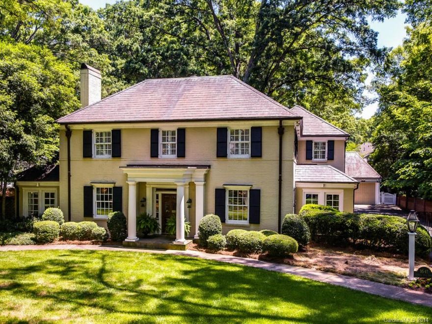 Classic 2-story painted brick house on sought-after Queens Road West. Renovated from top to bottom. Large cooks kitchen with breakfast room. Nice size formals plus sunroom, den and great room. High ceilings & hardwoods. Master suite with fireplace, his/her closets & fabulous bath. Outdoor space is spectacular covered patio with fireplace, exquisite landscaping. 3-car garage with guest suite above. A true one of a kind!