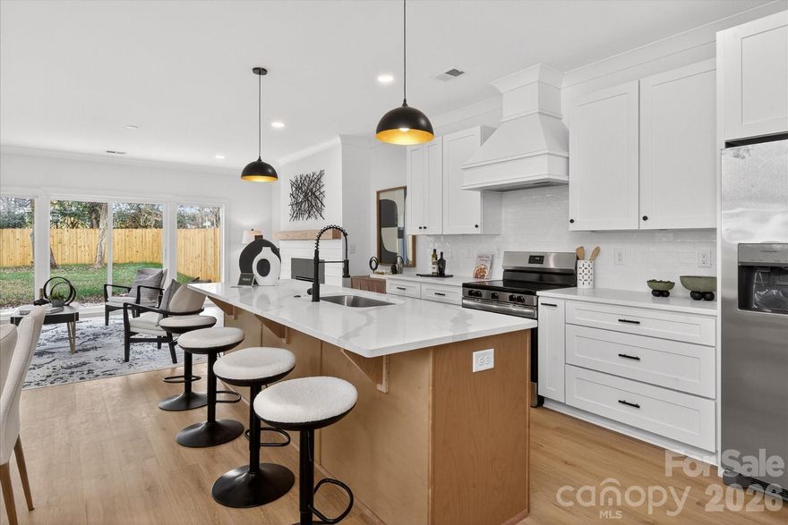 This is it! Qualified buyers can access up to $10,000 in lender credits and 100% financing (no PMI). Additionally, the builder is contributing $10,000 toward closing costs with an acceptable offer and preferred lender, offering a meaningful financial advantage from day one. Why compromise? The brand-new Lander Duets are 2,160-square-foot residences in the booming Seversville neighborhood, offering the space of a single-family home with the convenience of city living. Steps away from the Stewart Creek Greenway and Savona Mill, you have direct access to Uptown and South End and are just 10 minutes from CLT Airport. The interiors showcase refined design, featuring high ceilings and an inviting living area centered around a gas fireplace with shiplap detailing and an oak mantle. The kitchen is the centerpiece of the home, boasting a quartz island, ample cabinetry, and a generous walk-in pantry with built-in outlets, before transitioning through sliding glass doors to a private fenced backyard. The upper level maximizes functionality with a versatile loft and a massive primary suite featuring a freestanding soaking tub, dual quartz vanities, and direct laundry access. Highlights include high-speed hard-wired internet throughout, energy-efficient systems, a custom drop zone, and an oversized one-car garage. Complete with a 1-year builder warranty and quick access to Camp North End, you’re investing in one of Charlotte’s most exciting growth corridors.