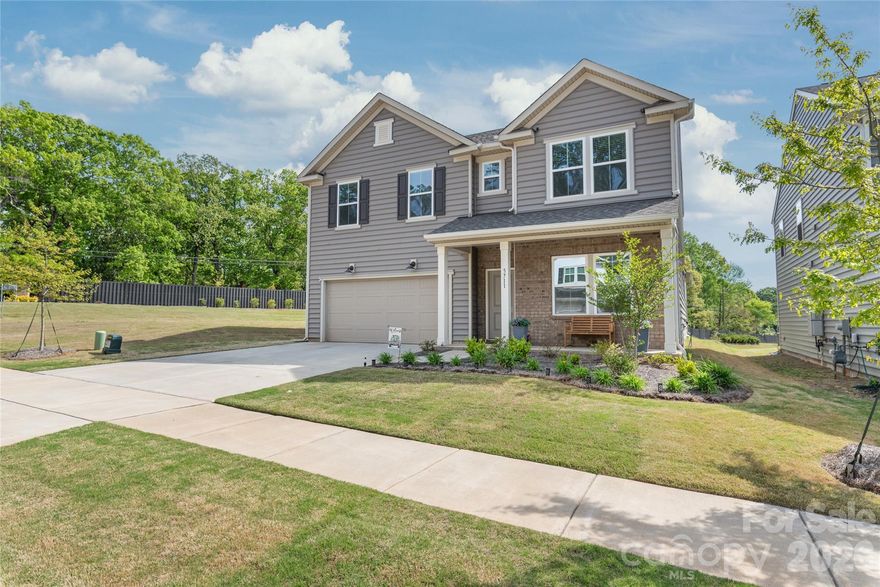 Better than new without the wait, welcome to this one-owner Pulte home in an almost complete east Charlotte community. Why pay more for new construction when this move-in ready home already offers the upgrades, window coverings, and finished outdoor living you’ll want from day one? Step in from the covered front porch to LVP flooring and crown molding throughout the main level, plus a double-door office that’s perfect for today’s lifestyle. The open kitchen, dining, and living space is designed to gather, featuring a large island with sink, quartz countertops, gas range, vented microwave, coffee bar, and ample storage. A main-level bedroom and full bath provide flexibility for guests or multi-gen living. Upstairs, enjoy a spacious loft, three additional bedrooms, and convenient second-floor laundry. The primary suite includes a tray ceiling, walk-in closet, and private bath with dual vanities and tile shower. Out back, a screened porch and extended patio overlook a level and then sloped yard -creating added privacy and a buffer you won’t find in many newer homes. Thoughtfully maintained and truly move-in ready, this is the one buyers have been waiting for. High-Speed Internet and TV Bundle Included in the HOA Fees