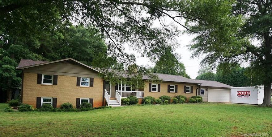 Home Warranty. Remodel includes: new flooring thru-out, new grey & white interior paint (walls, trim, doors & FP), new white kitchen cabinets w/granite, new white BA vanities w/granite, new cabinet hardware, new vanity mirrors, new lavatories, new lighting thru-out, new faucets in kit & baths & new Whirlpool stainless appliances. Add'l newer updates include: roof, dbl hung windows (bsmt too), vinyl rails, steps on the covered front porch & a very large back deck. Quick access to I-40 & Hwy 70.