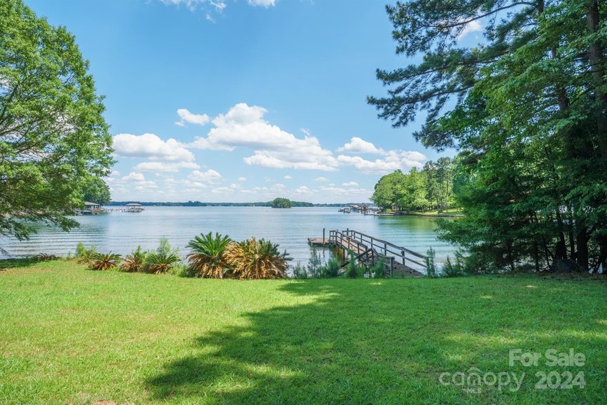 Stunning main channel Lake Norman views from this very generous .96 of acre waterfront property. No HOA just outside the point.
161 feet of lake frontage perfect for boating and enjoying all Lake Norman has to offer.
Home has a wonderful view of the lake with a galley style kitchen large living room with a beautiful vaulted tongue and groove ceiling. Two bedrooms on main floor and a loft/bedroom on the second level. Attached unfinished 767 sq foot rec room that could easily be finished. Outside rear deck is covered and has uncovered area as well to enjoy this great waterfront view. Home could be updated or a new construction home could be an option. If you are looking for a unbelievable view of Lake Norman this is a must see in your search.