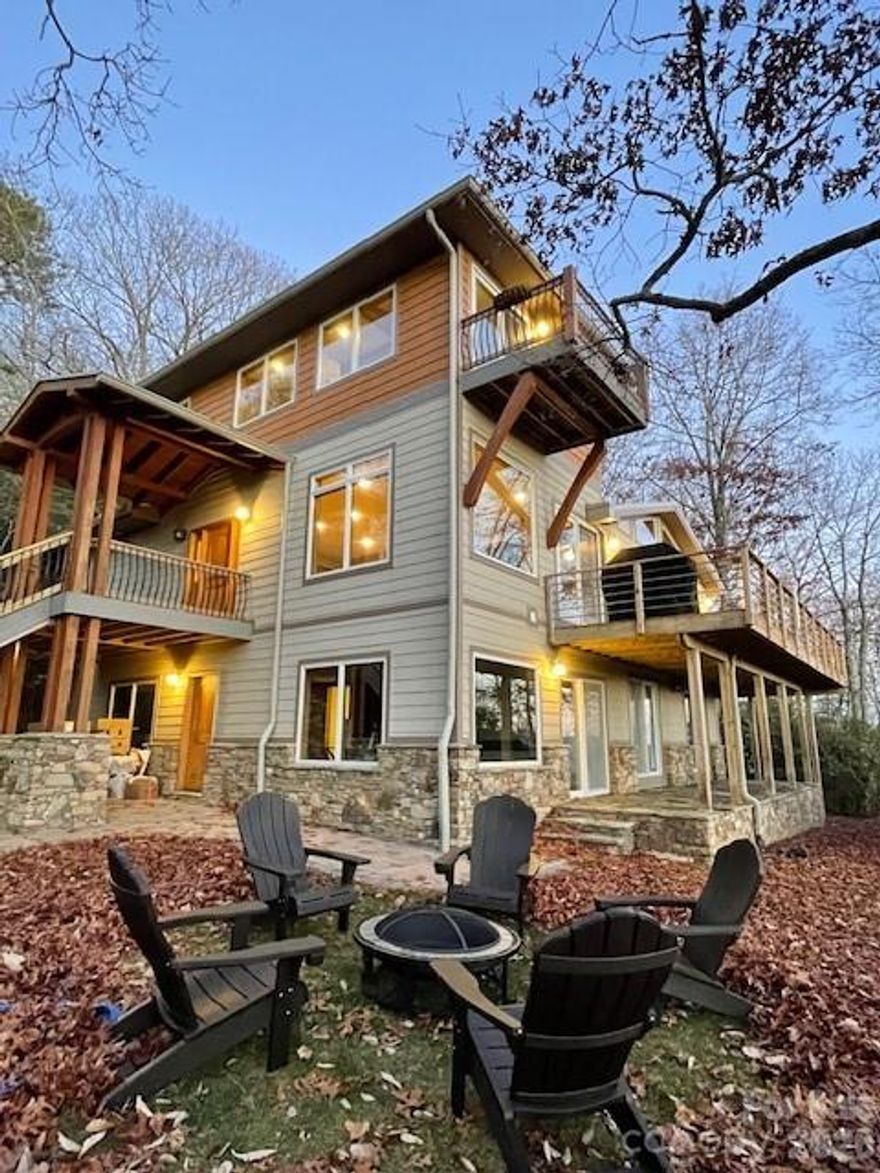 Wake up to sweeping mountain vistas and end your evenings with unforgettable sunsets from this beautifully crafted home privately situated on 2.17 acres., this exceptional mountain residence offers sweeping year-round long-range views and an ideal blend of luxury, efficiency, and peaceful living. Located just 20–25 minutes from Asheville, Asheville Regional Airport, Hendersonville, and Black Mountain, this home delivers the perfect balance of convenience and true mountain escape.
Designed with intention and built with quality in mind, the home is filled with natural light and showcases stunning southwestern views from most rooms. Outdoor living is a highlight...relax on the porch, entertain guests and take in unforgettable sunsets and the ever-changing beauty of Western North Carolina’s seasons.
Energy-conscious features include a standing seam metal roof, geothermal heating and cooling with ERV system, spray foam insulation on all exterior walls, and an EV-ready charging outlet.
Impeccably maintained and beautifully styled, the interior reflects pride of ownership at every turn. A rare opportunity to own a one-of-a-kind home where design, privacy and sustainability come together in a truly remarkable setting.