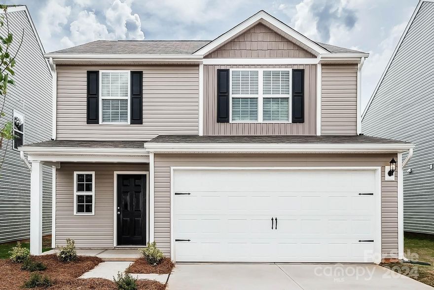 This 4-bed home has a spacious and airy feel that has been designed with your needs in mind. The large kitchen is open to the dining area and living room and has stainless steel appliances, gorgeous granite countertops, 36” upper cabinets with brushed nickel hardware and a large island. The master is tucked away on the second floor of the home with plenty of natural light and a fabulous master bath. In the master bath you will find a large vanity, great storage and an impressive walk-in closet.