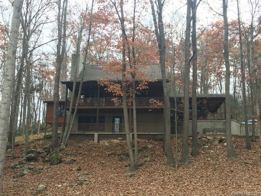 Conveniently located just off Hwy. 209 in Hyder Mountain Acres, this home features beautiful bamboo hardwood floors, updated kitchen, spacious dining room, versatile loft space, plus bonus rooms in basement.  From the comfort of the stunning wrap around deck you'll enjoy mountain views and over sized 1.2 acre lot.  Soaring ceilings in the living room enhance the massive stacked stone fireplace.  Double carport, charming patio space, detached single car garage with workshop, and extra storage!