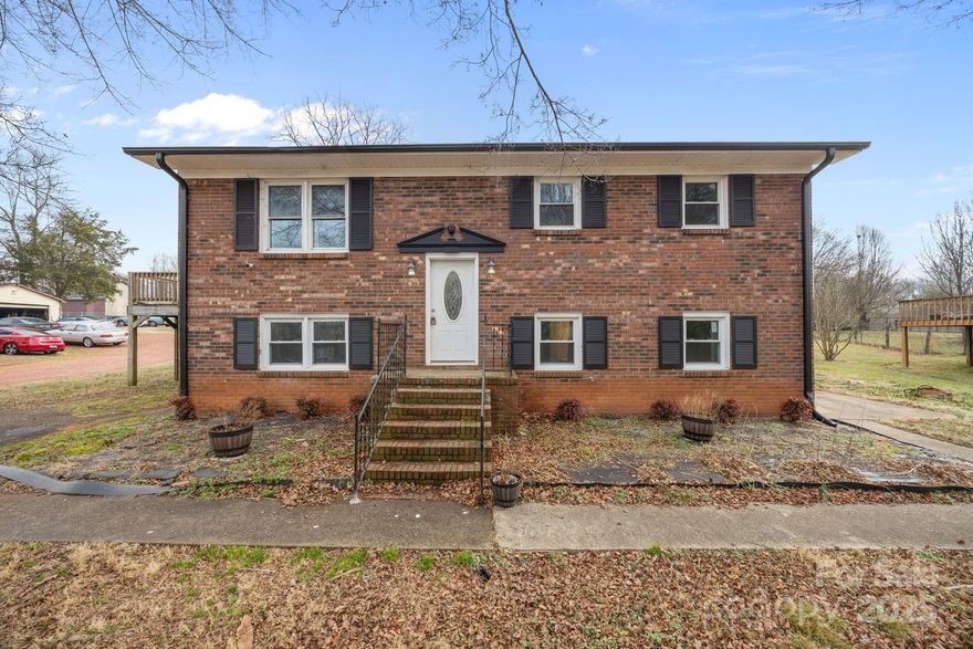 Welcome home to this unique split-level property offering space, flexibility, and character on a full one-acre lot in Statesville. With four bedrooms and a thoughtfully designed layout, this home stands out from the ordinary.
The main level features bright, comfortable living spaces, while the open lower level functions as a true second living room or extra space, perfect for entertaining, relaxing, or creating a home office or play area. This flexible layout gives you room to spread out while still feeling connected. Step outside and enjoy the deck overlooking the expansive yard, ideal for gatherings, grilling, or quiet evenings outdoors. The attractive brick-front exterior adds timeless curb appeal and sets the tone as you arrive. With multiple living areas, four bedrooms, and a layout that truly offers something different, this home is a rare find. Conveniently located with easy access to shopping, dining, and major routes, this is a property you will want to experience in person.