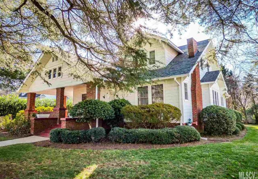 This classic 1926 Arts & Crafts style home is nestled on a tree-lined street in downtown Newton and is ready for its new owner! A large covered front porch leads to the spacious living room with fireplace and columned entrance to the formal dining room. Just off the living room, you'll find a private study with double French doors and side exit to the porch. The main level also has two spacious bedrooms, a hall bath, and kitchen with updated cabinetry, all appliances, and rear porch. Upstairs, a central landing leads to three bedrooms, all with generous closet space, storage attic, and a hall bath with claw foot tub and separate shower. Outside, enjoy a sunny rear deck, private backyard, and double garage with 3rd bay for lawn equipment. Recent upgrades include roof (2013), heat (2015), tankless water heater, replacement windows, and more. Low maintenance aluminum and vinyl siding. Walk to Newton's downtown square with shops, dining, and more!