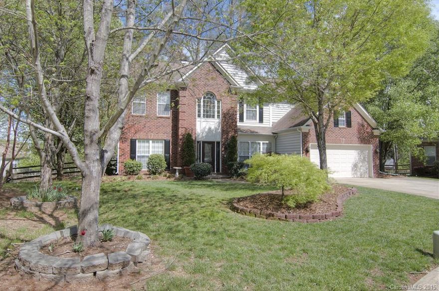 Gorgeous hand-scraped hrdwds invite you in to soaring 2-story foyer & carry through formal DR & LR. Ofc w/french doors & built-in shelves. Oversized fam rm boasts wall of windows, ceiling fan & wood-burning FP. Kitchen offers cer tile floor, granite counters, SS appls (including fridge), double wall oven & center island w/pendant lighting. Beautiful sunroom. New carpet & fresh paint. Gorgeous new cer tile floors in mstr BA. Upgraded fixtures. BR/bonus w/rec room. Spacious deck & fenced yard.