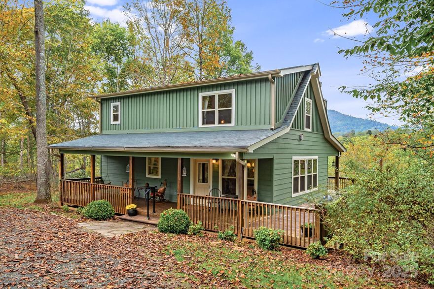 Resting on 3+ acres of serene woodlands, this private and thoughtfully designed home offers breathtaking, year-round mountain views from every bedroom and the wraparound porch. While the home is permitted for two bedrooms, the versatile loft space—complete with a built-in closet—provides the perfect opportunity for a third bedroom or an additional living area to suit your needs.

This retreat boasts elegance, with warm wood interiors, vaulted ceilings, and large windows that frame the natural surroundings. Featuring a spacious open floor plan, a gas log fireplace, and a fully equipped kitchen, this cabin is ideal for both relaxation and entertaining. The wraparound deck offers the perfect spot to sip your morning coffee or stargaze at night. Located just minutes from scenic hiking trails and local attractions, this home is a true gateway to year-round exploration. Don’t miss this rare opportunity to own your own slice of mountain paradise!